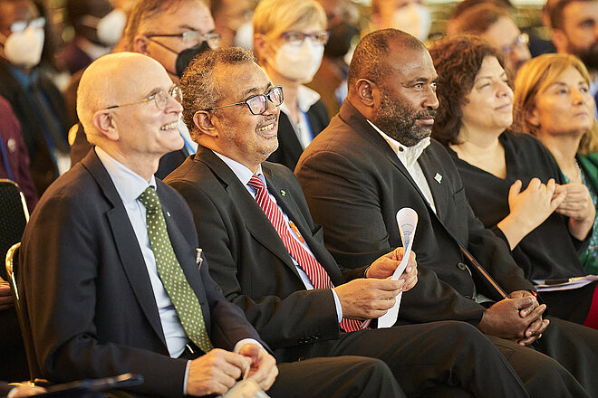 Axel R. Pries and Tedros Adhanom Ghebreyesus with others sitting in the WHS 2022 closing session